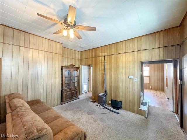 living room featuring ceiling fan and light carpet