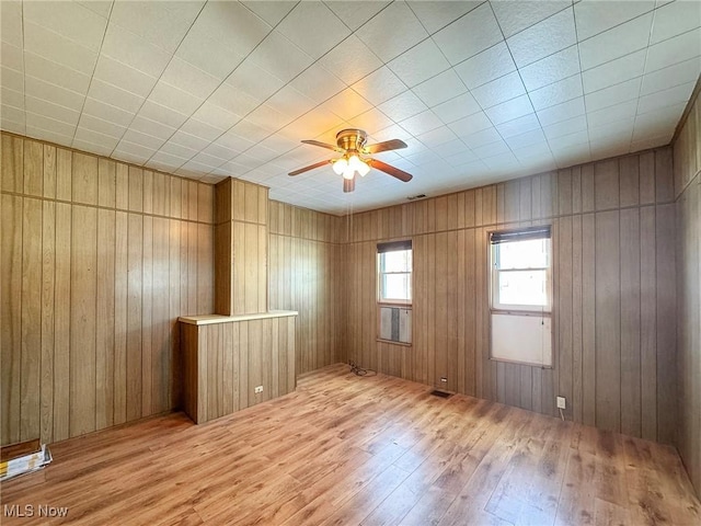 empty room featuring wood-type flooring and ceiling fan