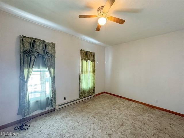 empty room with ceiling fan and a baseboard radiator