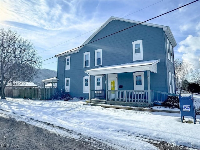 view of property featuring covered porch