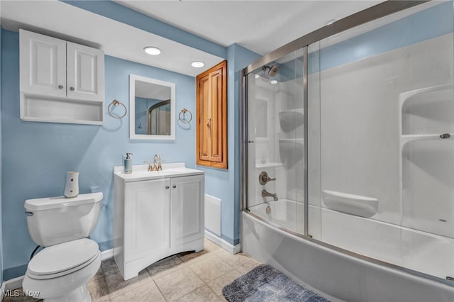 full bathroom with combined bath / shower with glass door, toilet, tile patterned floors, and vanity