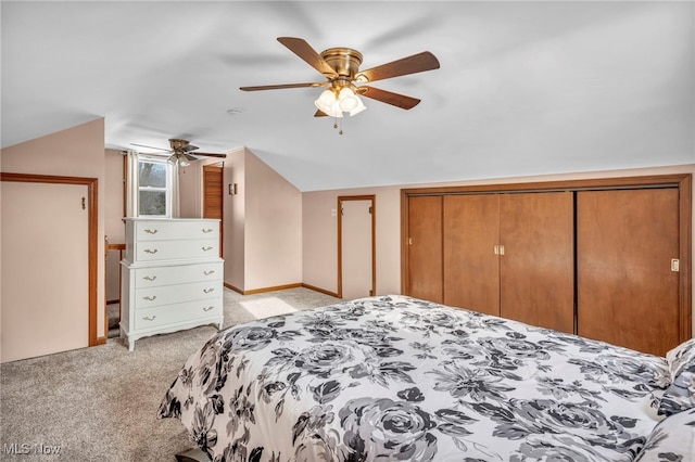 carpeted bedroom featuring ceiling fan and vaulted ceiling