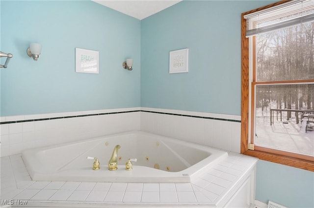 bathroom featuring tiled tub