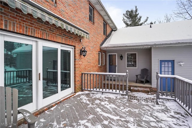 view of snow covered deck