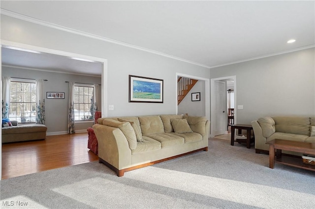 living room featuring carpet and ornamental molding