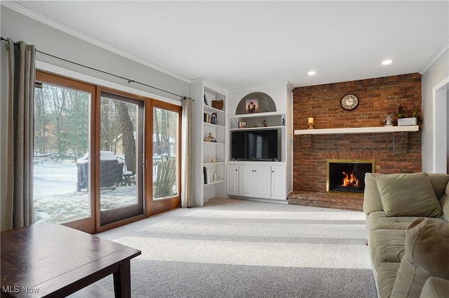 carpeted living room featuring crown molding, built in features, and a brick fireplace