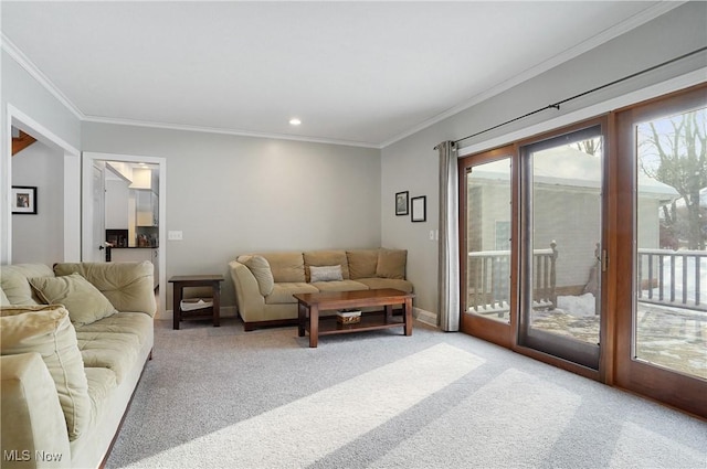 carpeted living room with ornamental molding