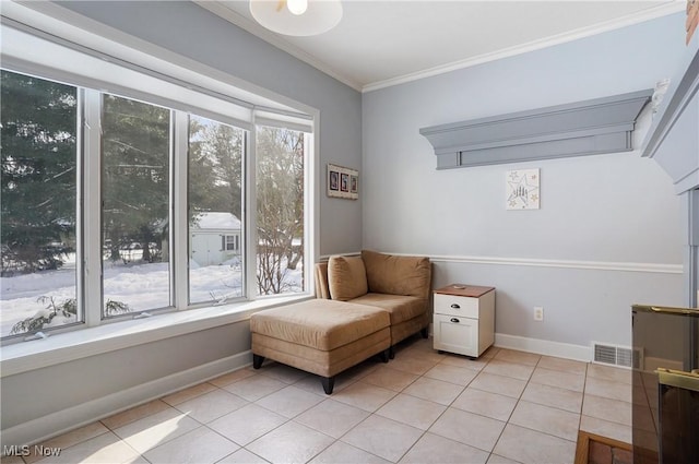 living area with light tile patterned floors and ornamental molding