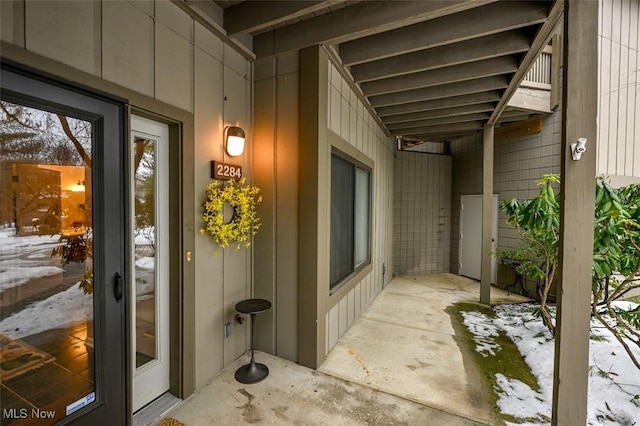 view of snow covered property entrance