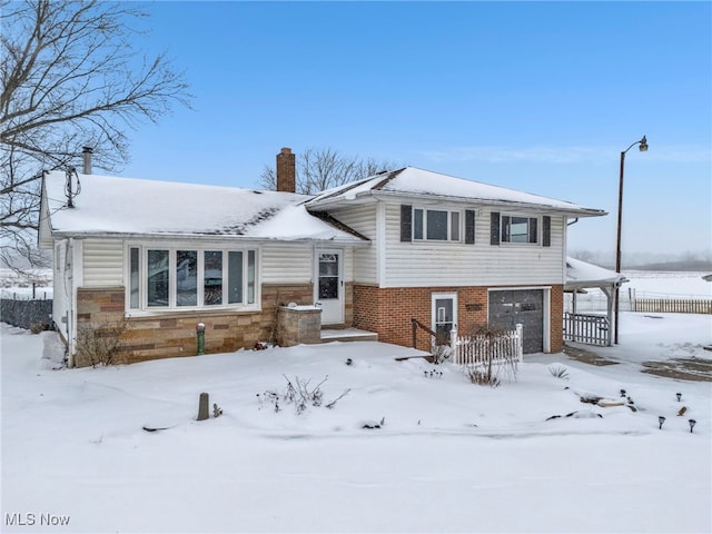 split level home featuring a garage