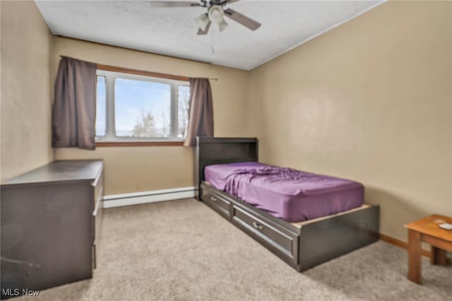 bedroom featuring ceiling fan, light carpet, and a baseboard heating unit