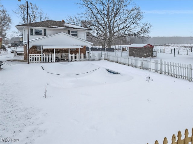 view of yard layered in snow