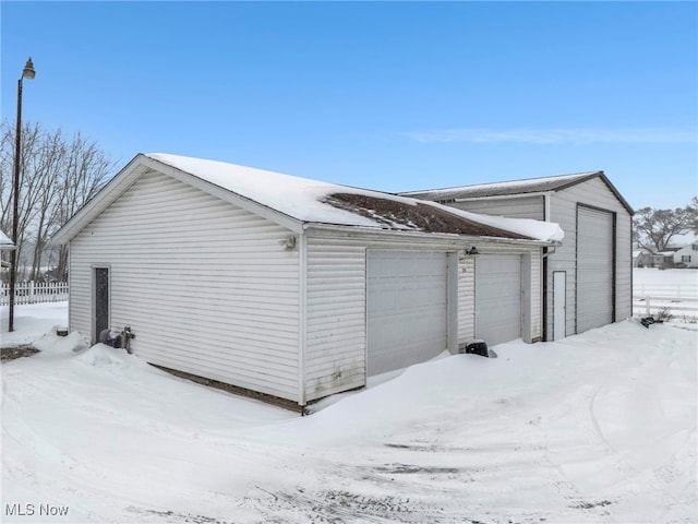 view of snow covered garage