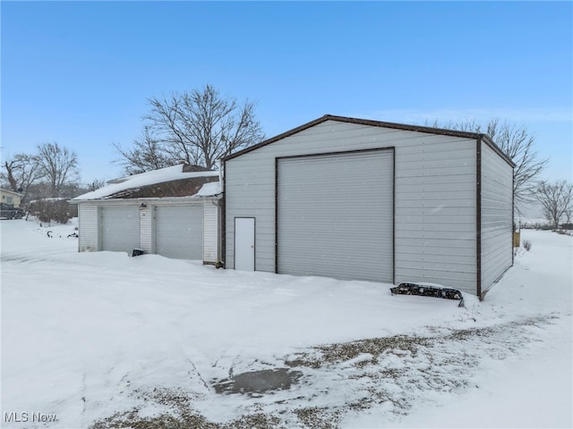 view of snow covered garage