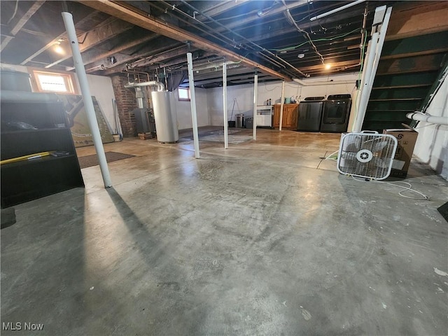 basement featuring gas water heater and washer and dryer