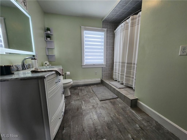 bathroom with baseboard heating, wood-type flooring, vanity, a shower with curtain, and toilet