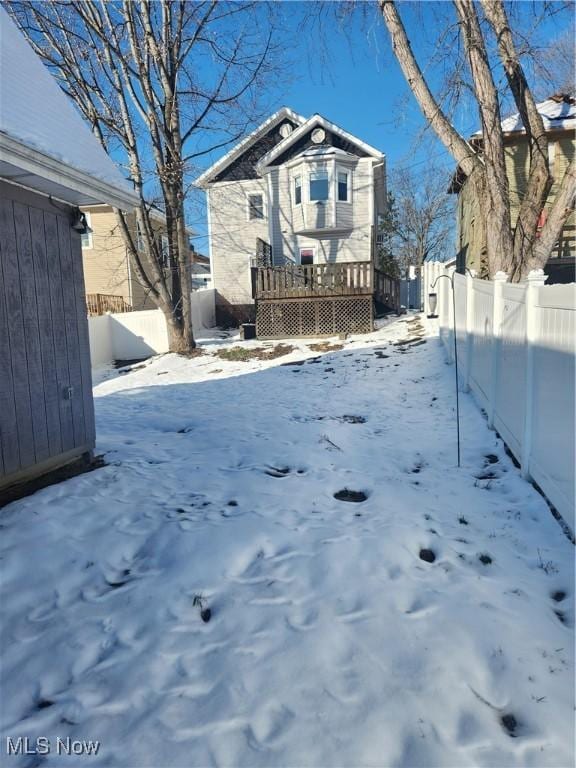 view of yard covered in snow