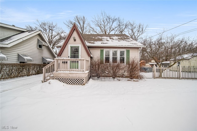 view of snow covered back of property