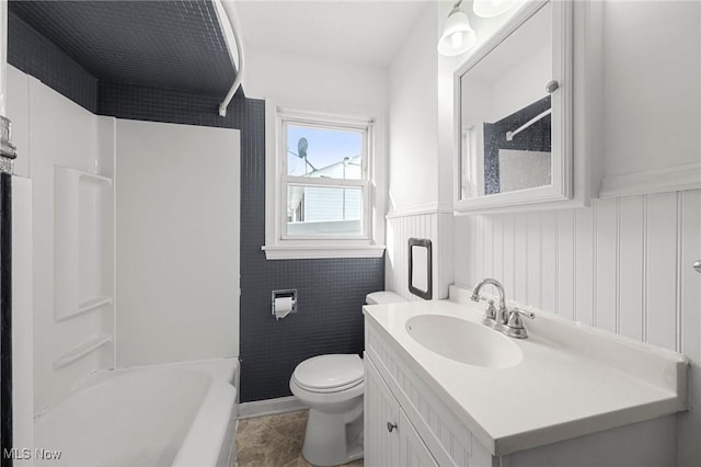 full bathroom featuring toilet, shower / tub combination, and vanity