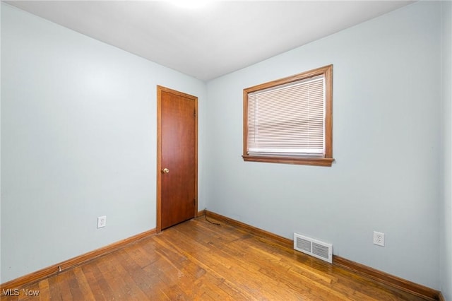 unfurnished room with light hardwood / wood-style floors