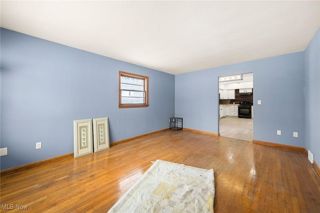 empty room with light wood-type flooring