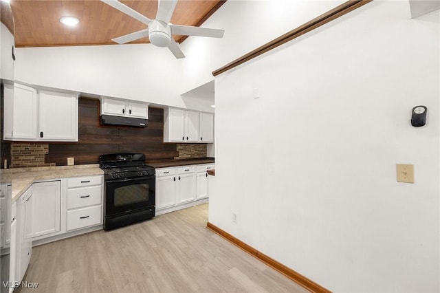 kitchen featuring white cabinets, lofted ceiling, tasteful backsplash, black gas range, and wooden ceiling