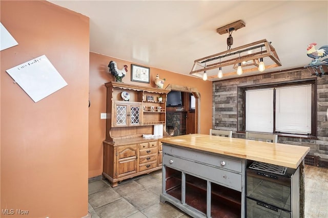 kitchen featuring butcher block counters and light tile patterned floors