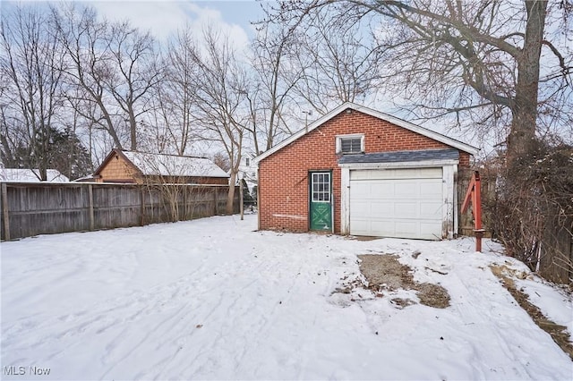 view of snow covered garage