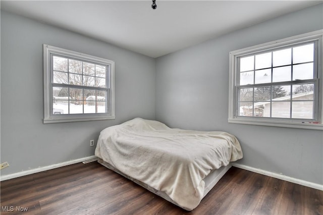 bedroom featuring dark wood-type flooring