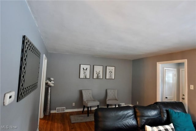 living room featuring dark hardwood / wood-style flooring