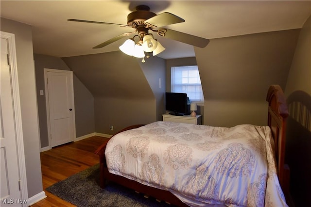 bedroom with wood-type flooring, lofted ceiling, and ceiling fan