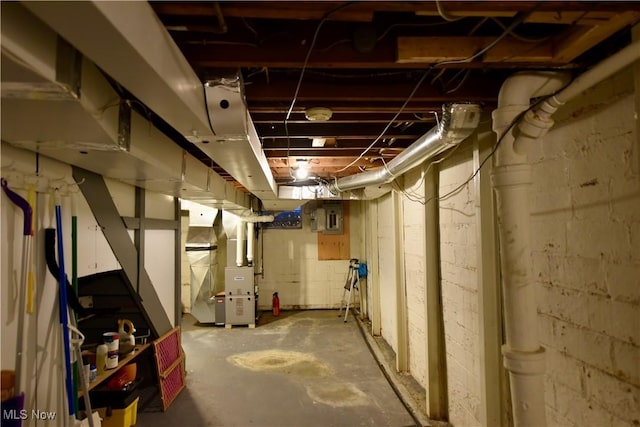 basement with heating unit and electric panel