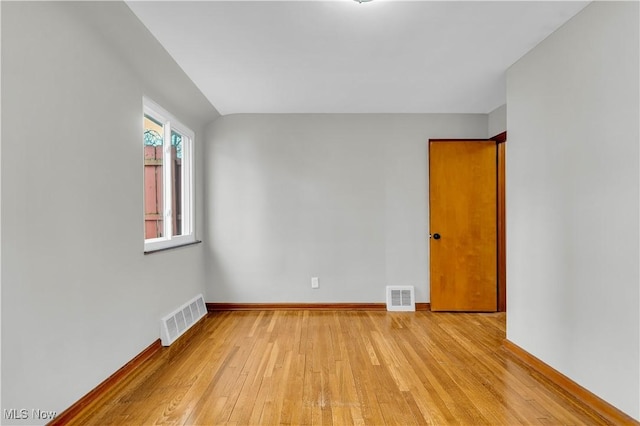 spare room featuring light wood-type flooring