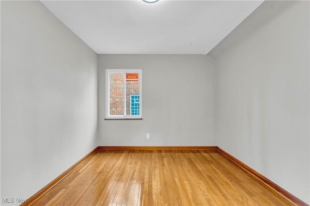 spare room featuring hardwood / wood-style flooring