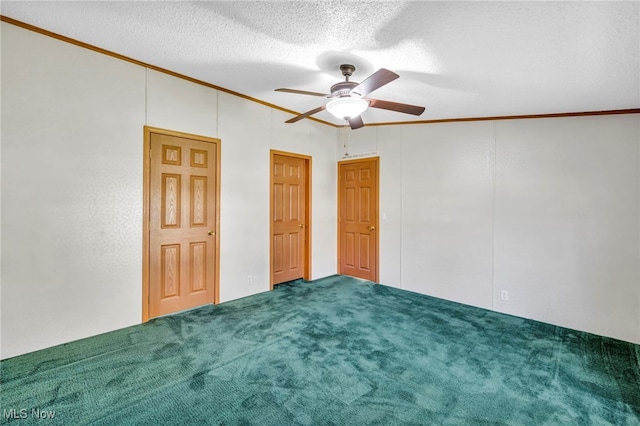 unfurnished bedroom with crown molding, carpet flooring, a textured ceiling, and ceiling fan