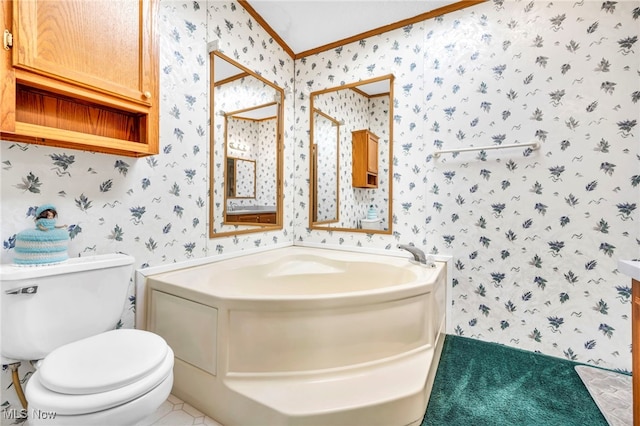 bathroom with a bath, toilet, and ornamental molding