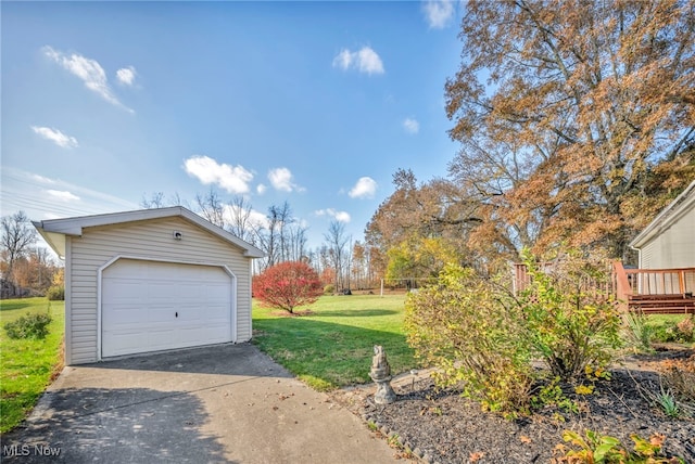 garage featuring a lawn