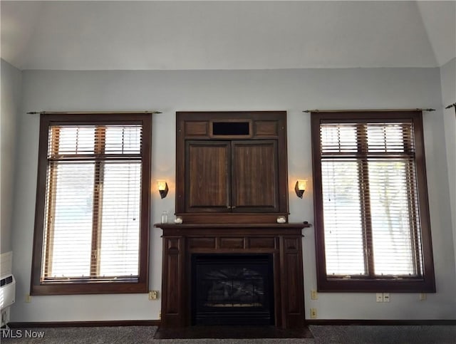 living room with dark colored carpet