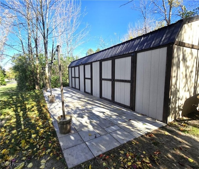 view of outbuilding with a lawn