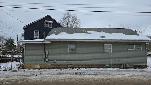 view of snow covered house