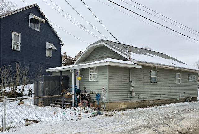 view of snow covered house