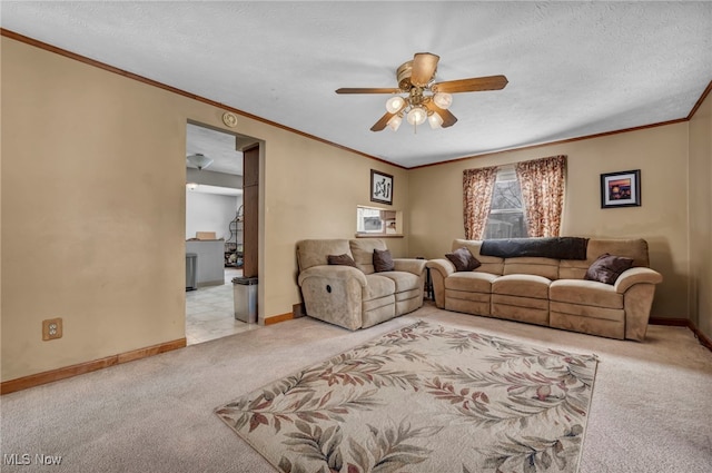 carpeted living room with crown molding, a textured ceiling, and ceiling fan