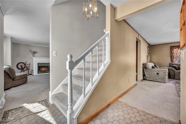 staircase featuring vaulted ceiling with beams, a chandelier, and carpet