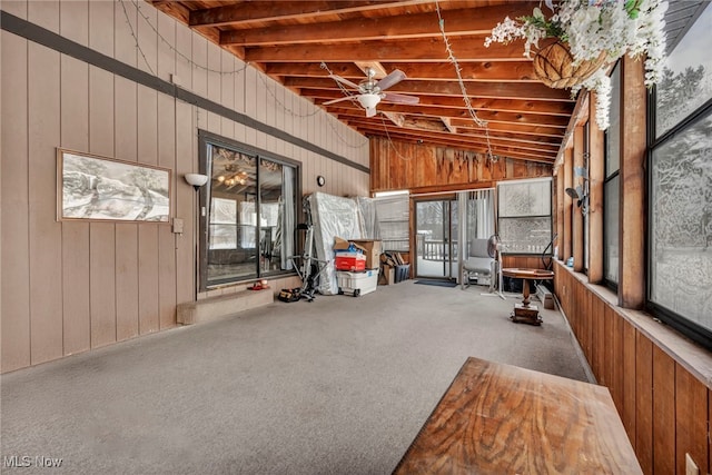 unfurnished sunroom with lofted ceiling with beams and ceiling fan