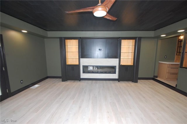 unfurnished living room with light hardwood / wood-style floors and ceiling fan