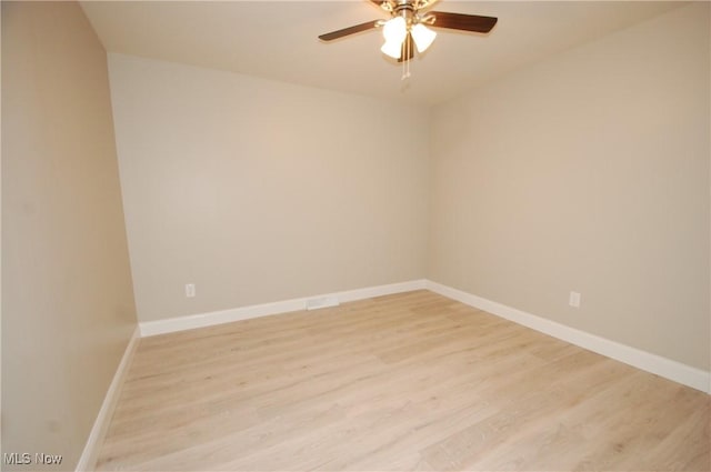 spare room featuring ceiling fan and light wood-type flooring