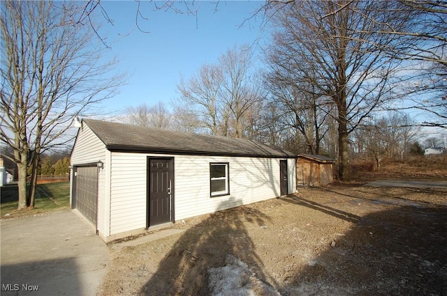 view of outbuilding with a garage