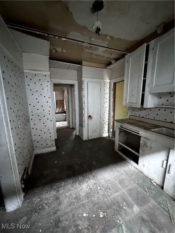 kitchen featuring white cabinets