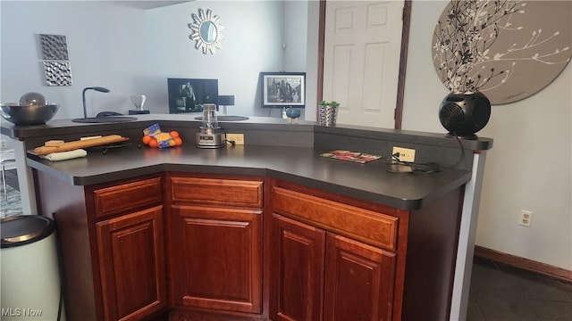 kitchen with dark tile patterned floors