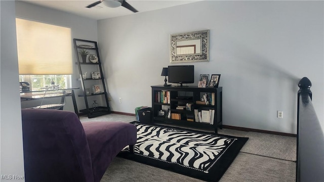 home office with ceiling fan and light colored carpet